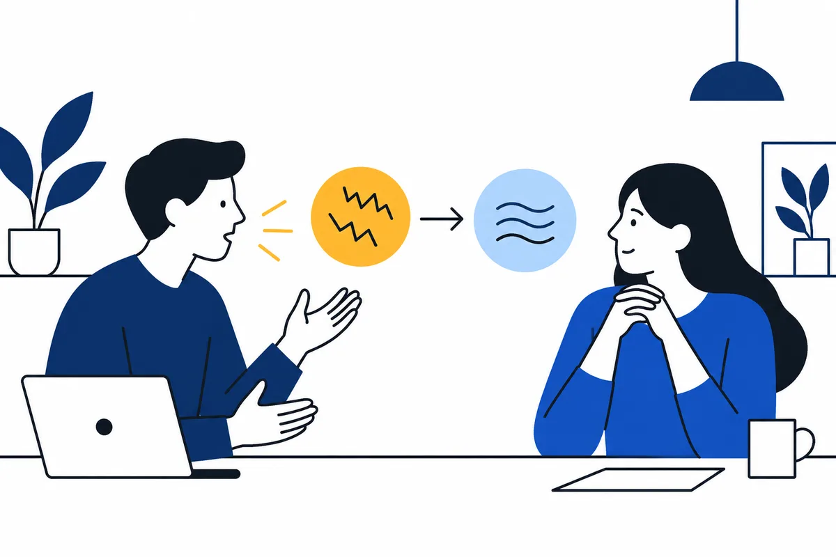 A man gestures toward two circles with jagged and wavy lines, linked by an arrow, as a woman listens across a table.