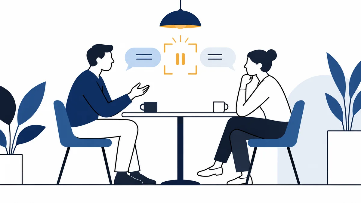 Illustration of two people talking across a table, with speech bubbles and a highlighted pause symbol between them.