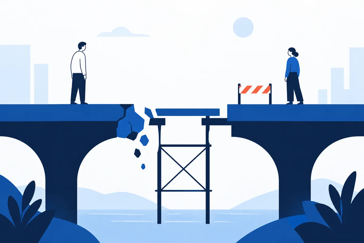 Two people stand on opposite sides of a broken blue bridge, with a small barrier and scaffold spanning the gap.